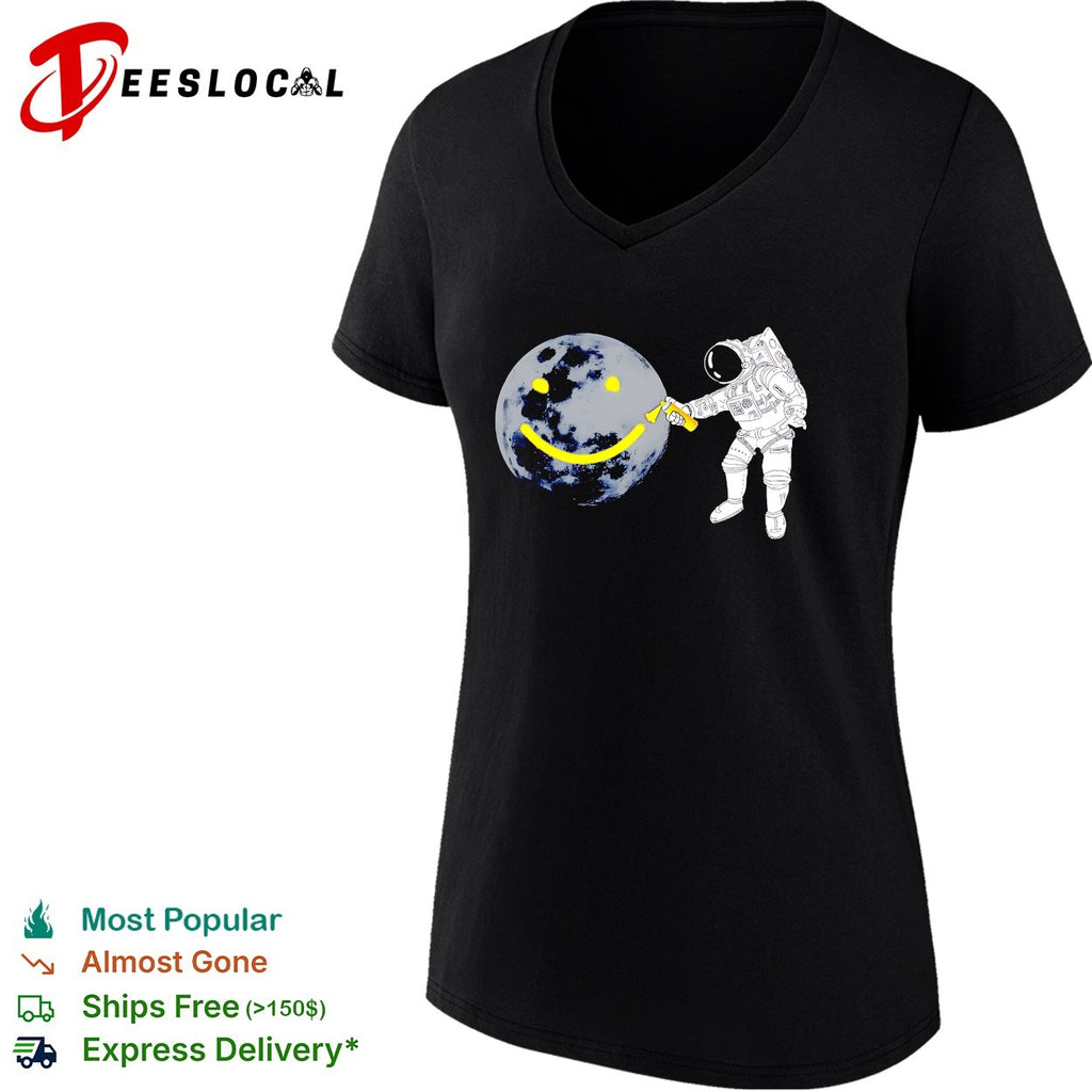 Astronaut spray painting smiley face on moon shirt