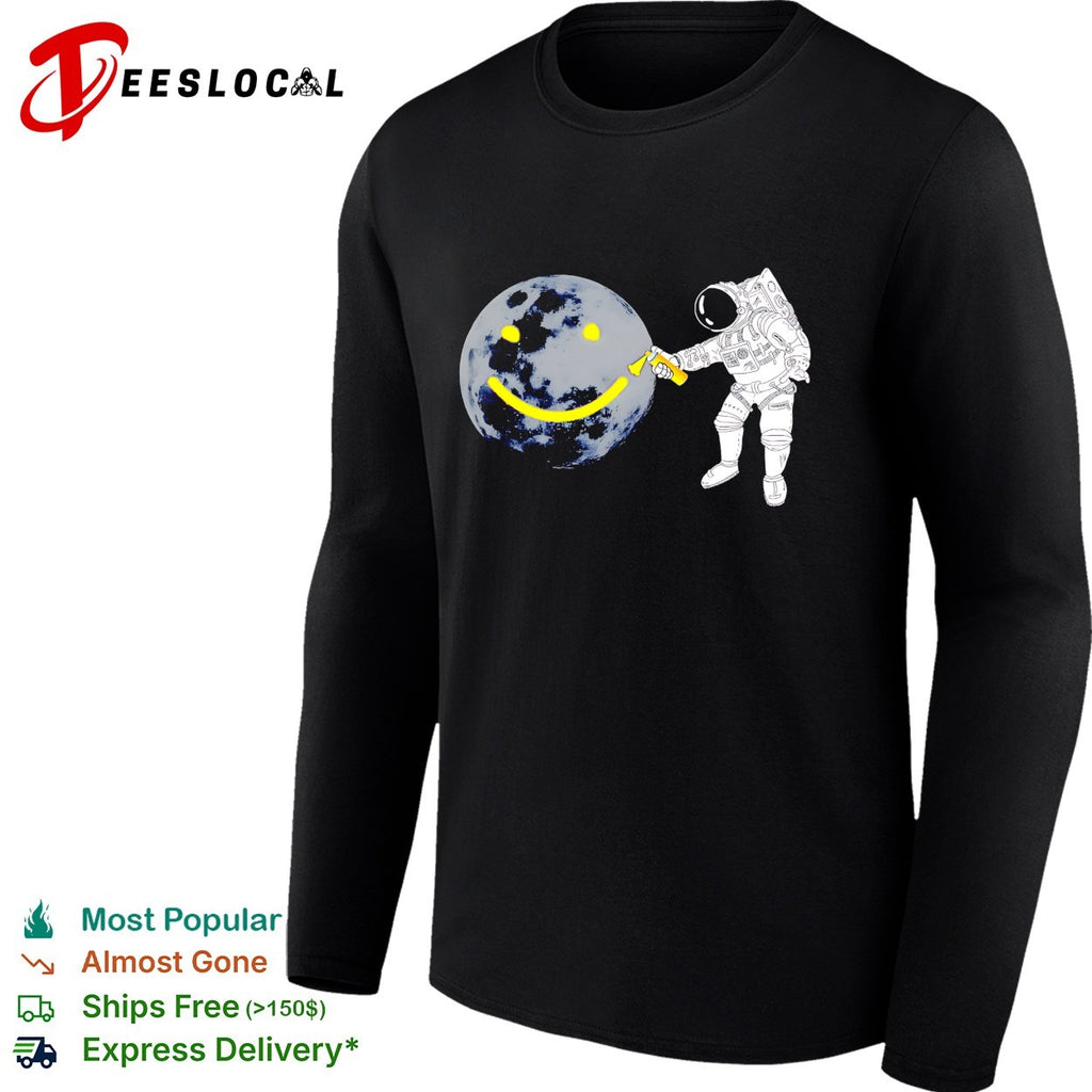 Astronaut spray painting smiley face on moon shirt