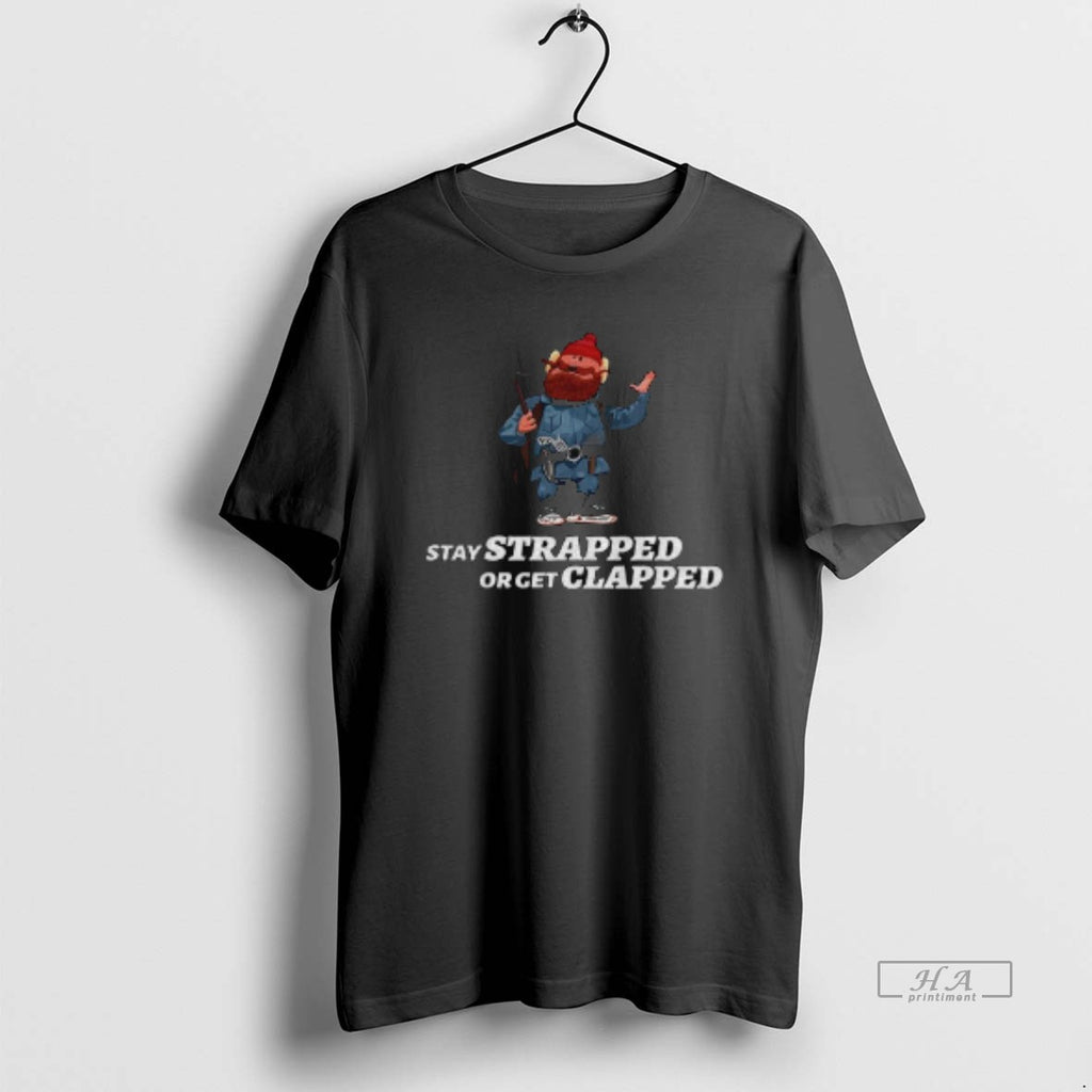 Official Yukon Cornelius Stay Strapped Or Get Clapped T-Shirts, Hoodie, Sweatshirt | InkRitualCo.com
