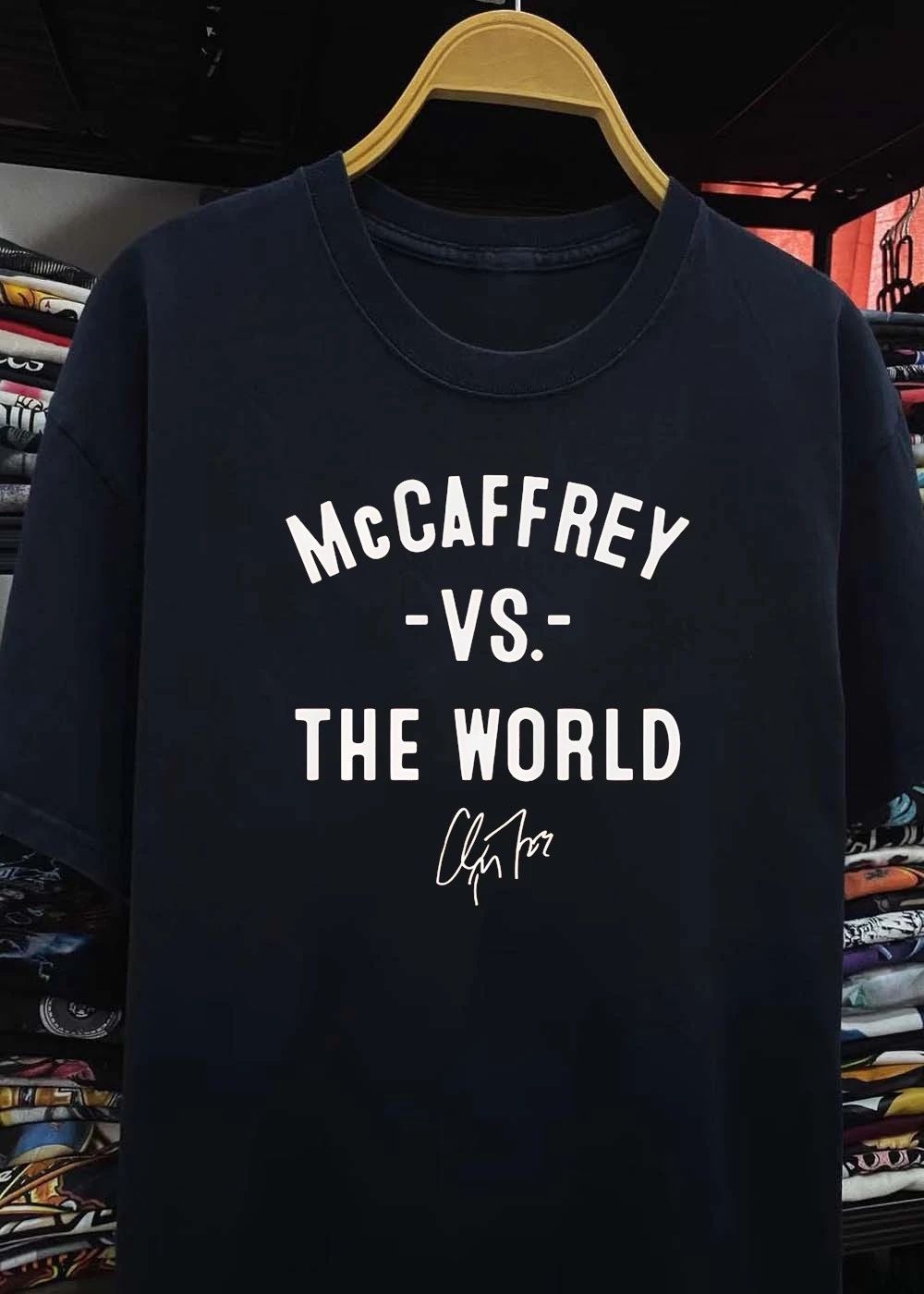 Christian McCaffrey Signature McCaffrey vs the World Football T-Shirt