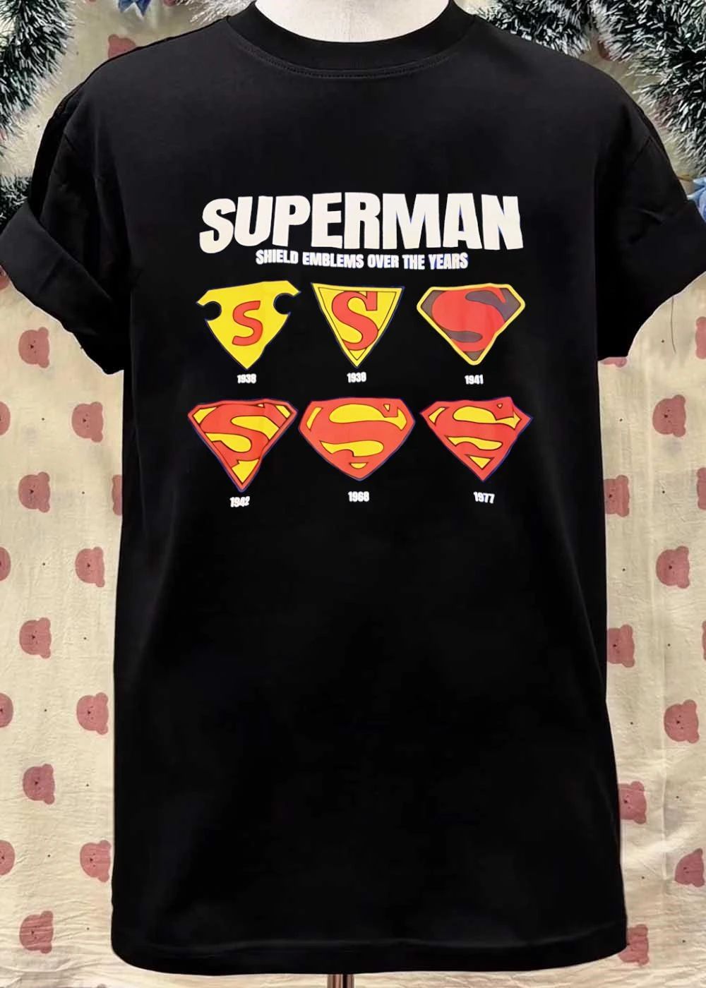 Shield Emblems Over the Years Superman T-Shirt