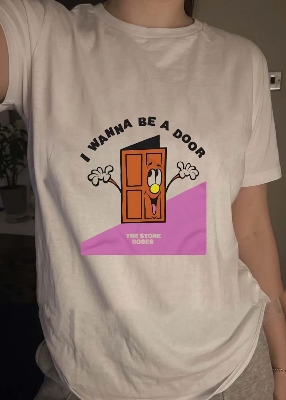 The Stone Roses I Wanna Be A Door Cartoon Smiling Character Yellow Nose Waving Hands shirt