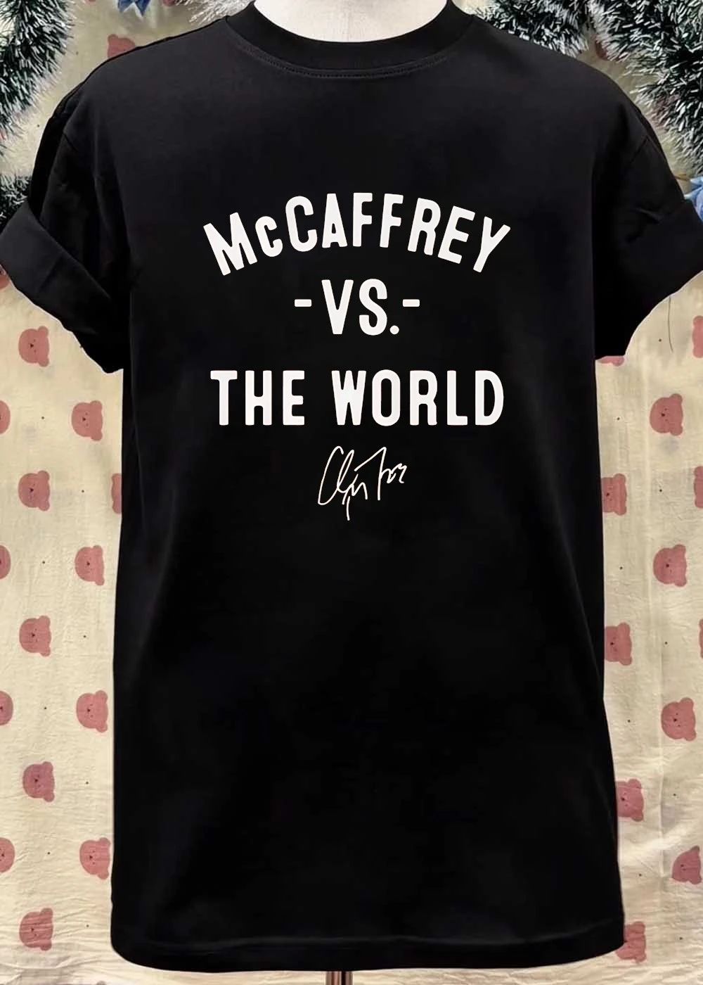 Christian McCaffrey Signature McCaffrey vs the World Football T-Shirt