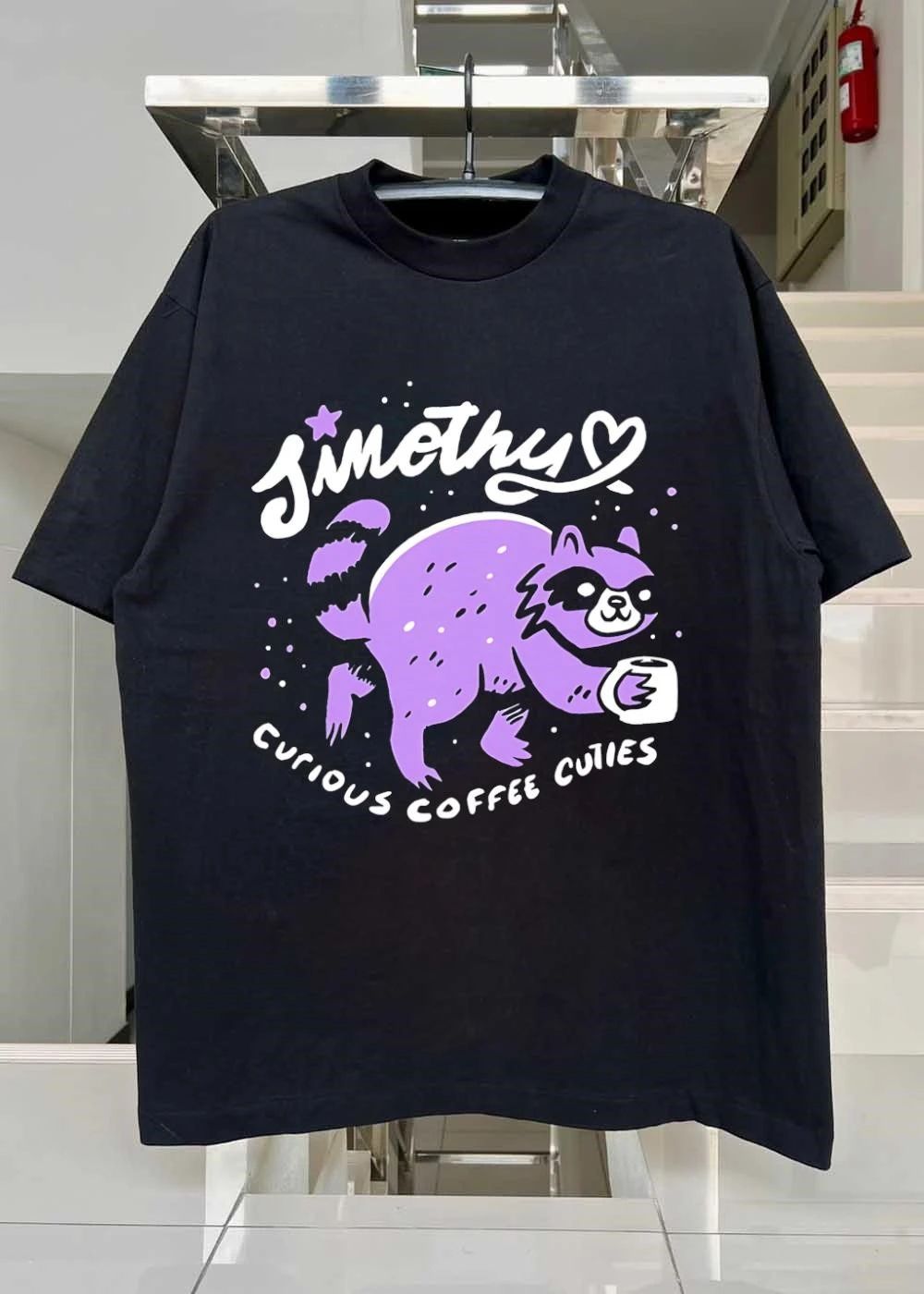 Curious Coffee Cuties Sinothy Raccoon Drinking Cup Shirt