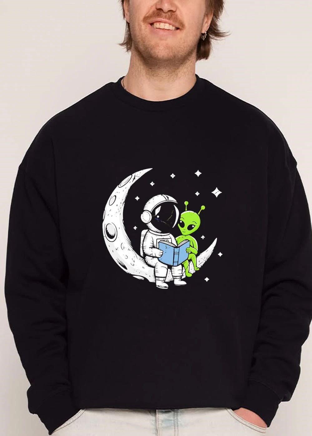 Cartoon Astronaut Green Alien Crescent Moon Reading Blue Book Stars shirt