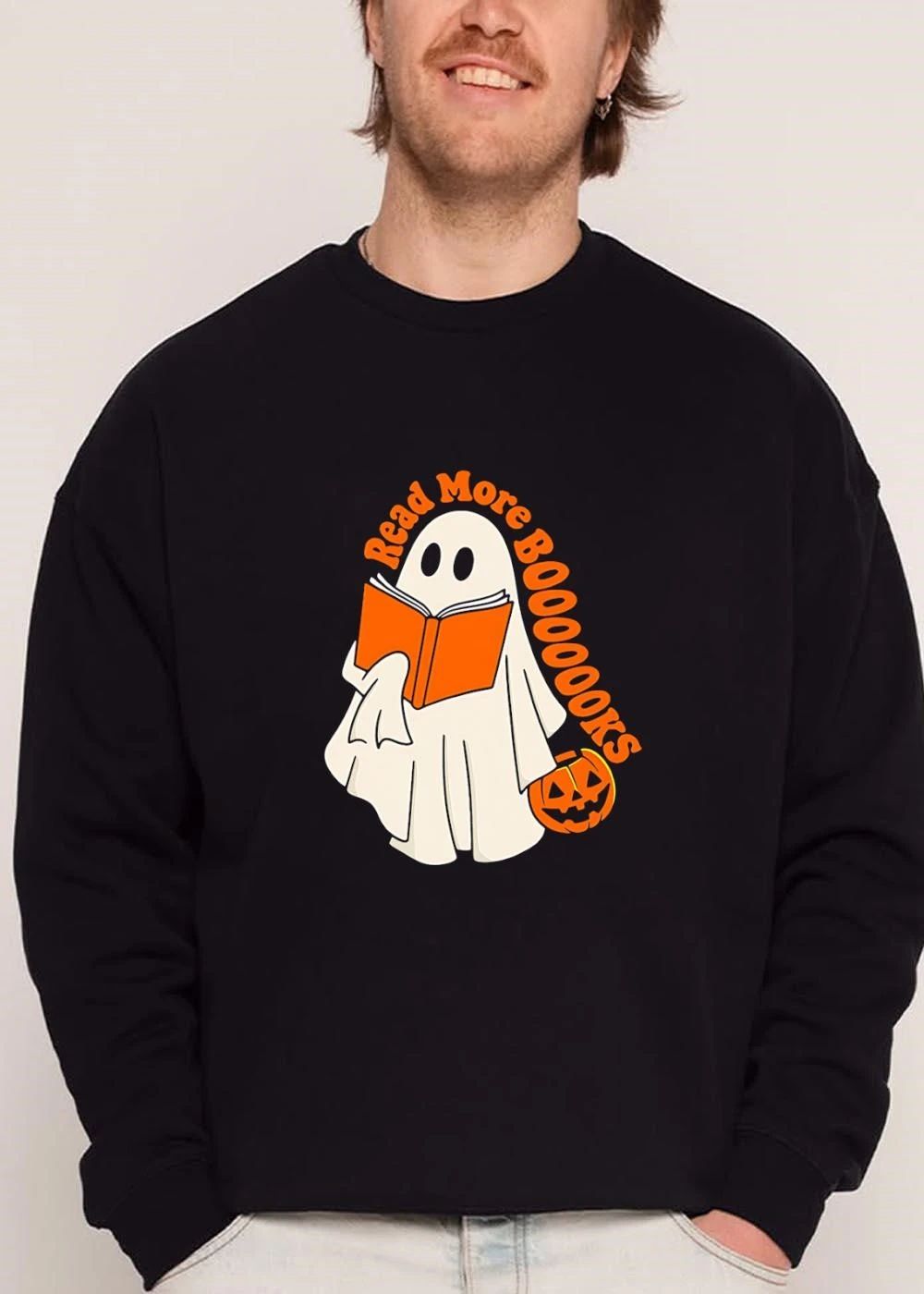 Read More Booooooks Cartoon Ghost Holding Orange Open Novel Pumpkin Bucket shirt
