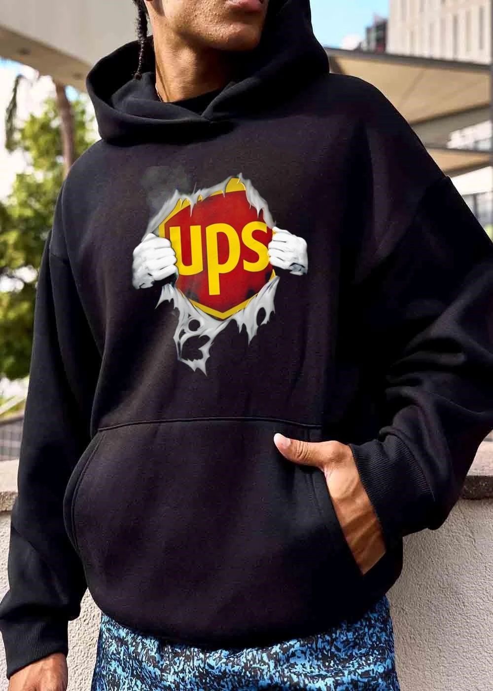 Ups Logo Hands Pulling Open Torn Gray Garment Revealing Superhero Shield shirt