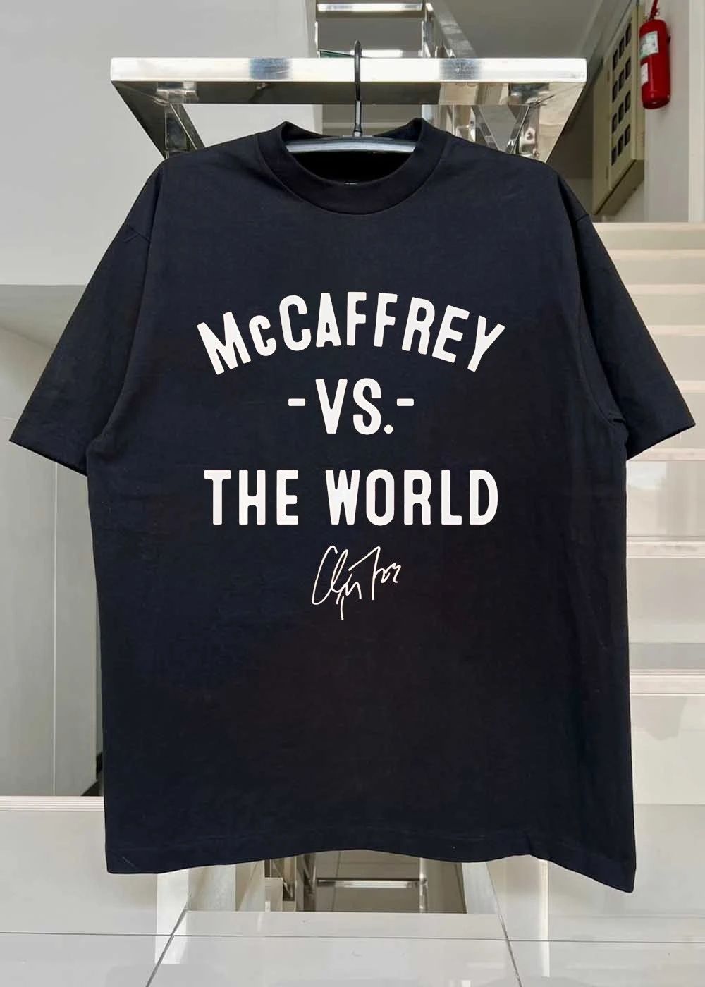Christian McCaffrey Signature McCaffrey vs the World Football T-Shirt
