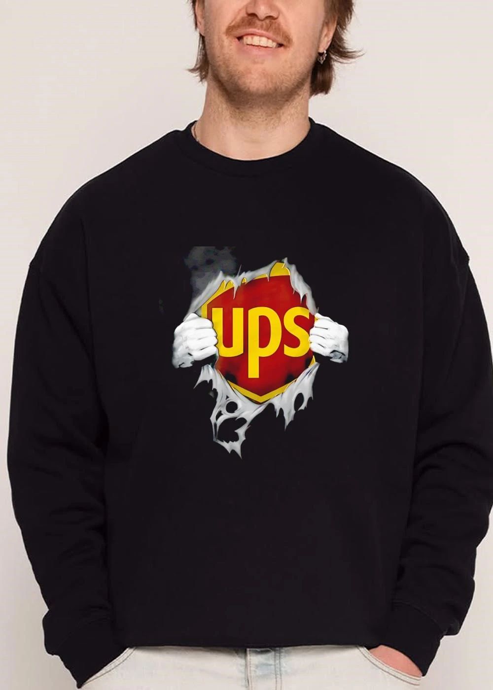 Ups Logo Hands Pulling Open Torn Gray Garment Revealing Superhero Shield shirt