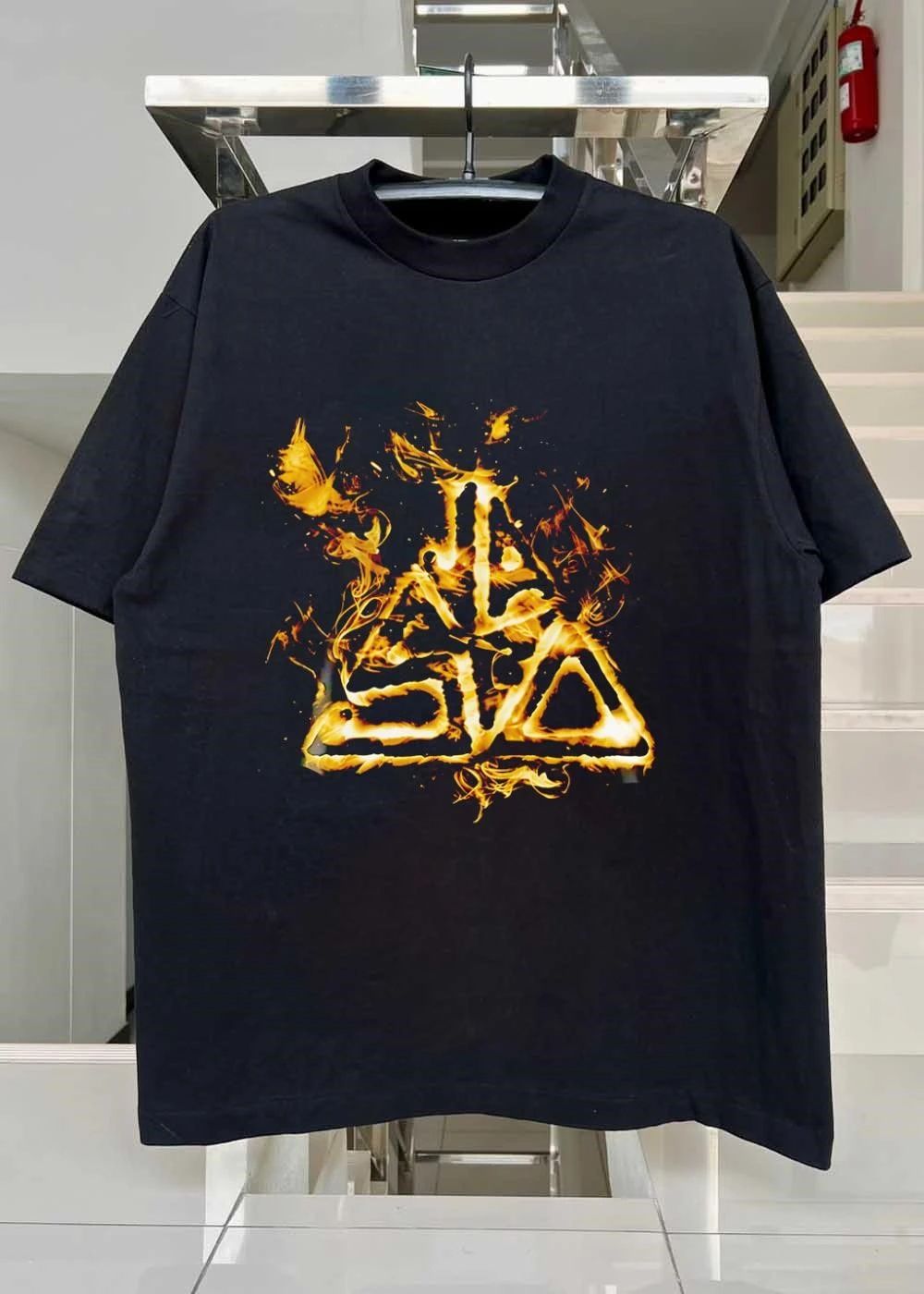 Fiery Golden Flames Stylized Triangle Crest Flaming Abstract Emblem Black Background shirt