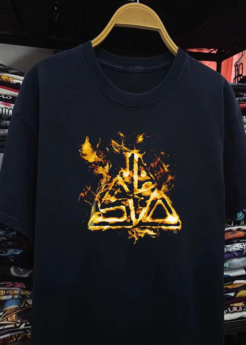 Fiery Golden Flames Stylized Triangle Crest Flaming Abstract Emblem Black Background shirt